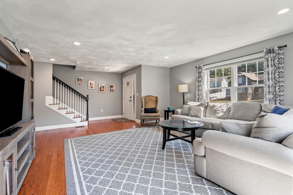 78 Oak Street, Unit 78 Clinton, MA 01510 - Photo 12 of 22 a living room with fireplace furniture and a flat screen tv