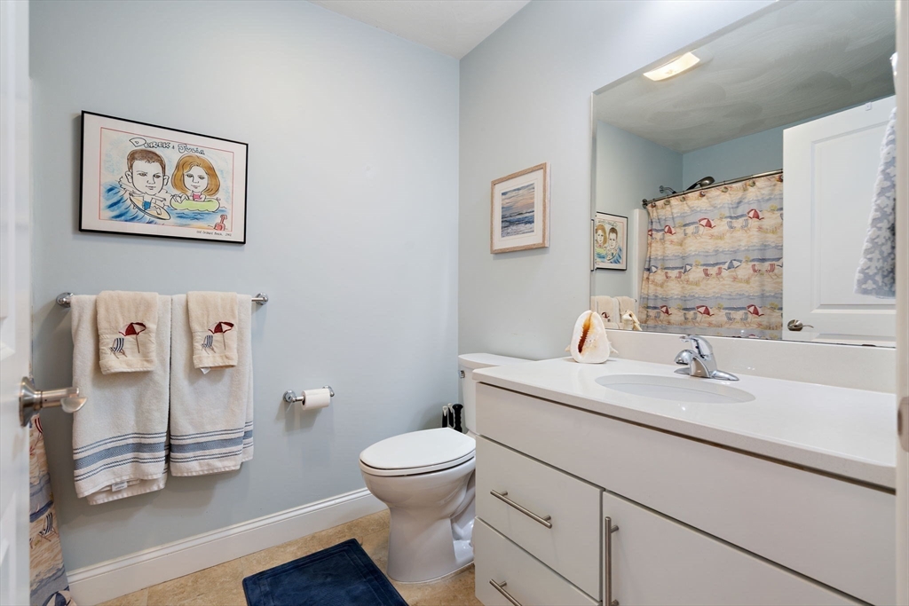 78 Oak Street, Unit 78 Clinton, MA 01510 - Photo 19 of 22 a bathroom with a toilet sink and mirror