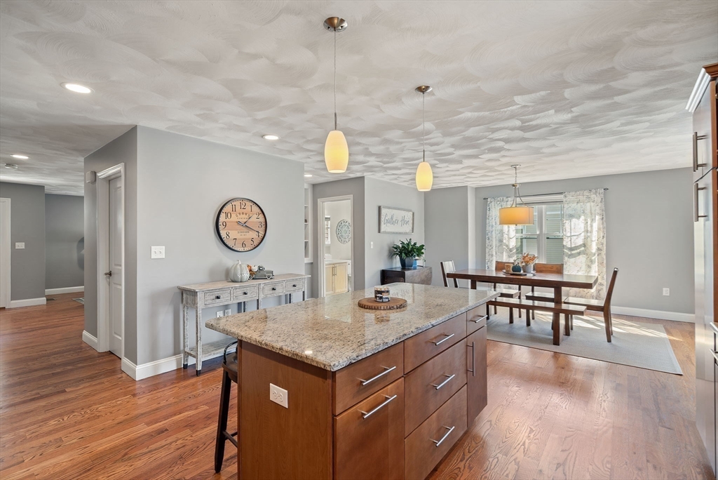 78 Oak Street, Unit 78 Clinton, MA 01510 - Photo 4 of 22 an open kitchen with a table and chairs