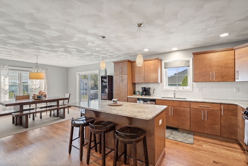 78 Oak Street, Unit 78 Clinton, MA 01510 - Photo 7 of 22 a large kitchen with a table and chairs in it