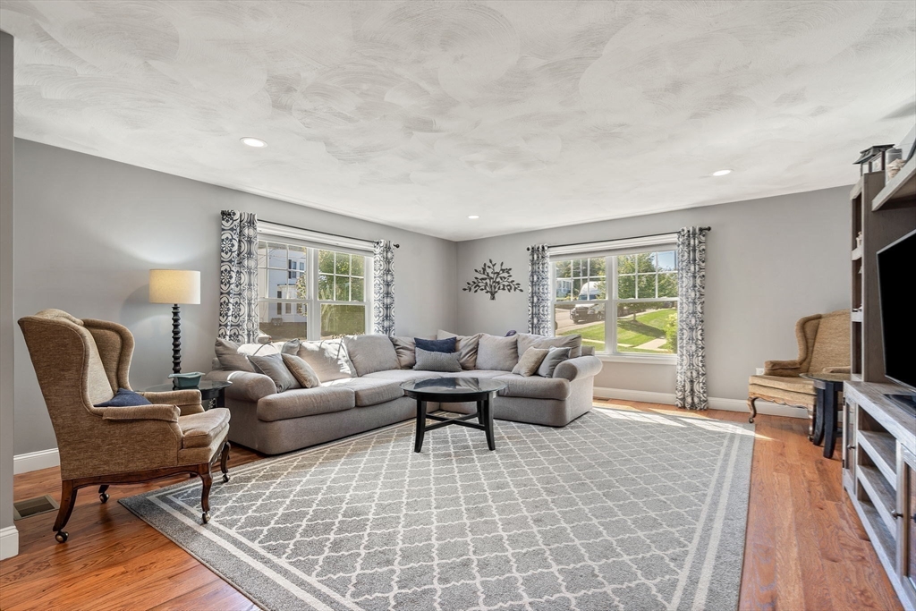 78 Oak Street, Unit 78 Clinton, MA 01510 - Photo 10 of 22 a living room with furniture and a flat screen tv