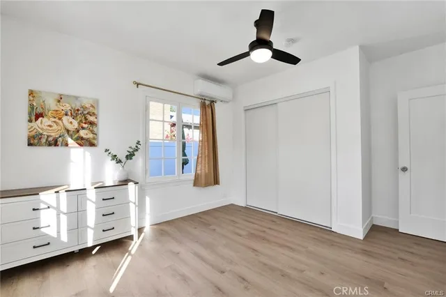 a view of livingroom with hardwood floor and ceiling fan