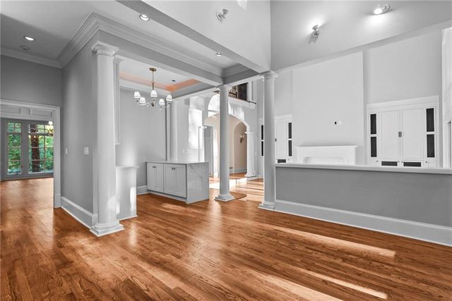 a kitchen with granite countertop a sink stainless steel appliances and cabinets