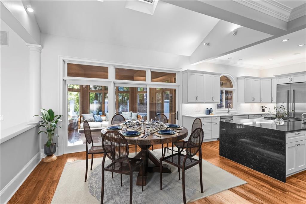 520 Chestnut Rose Lane Sandy Springs, GA 30327 - Photo 19 of 94 a dining room with furniture wooden floor and a rug