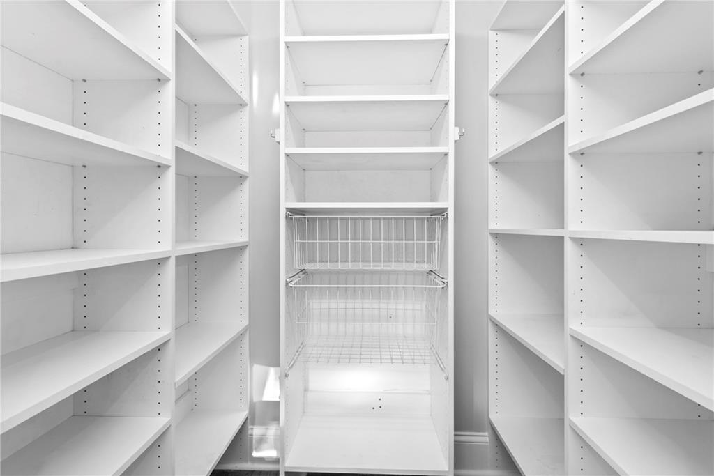520 Chestnut Rose Lane Sandy Springs, GA 30327 - Photo 28 of 94 a view of walk in closet with empty racks