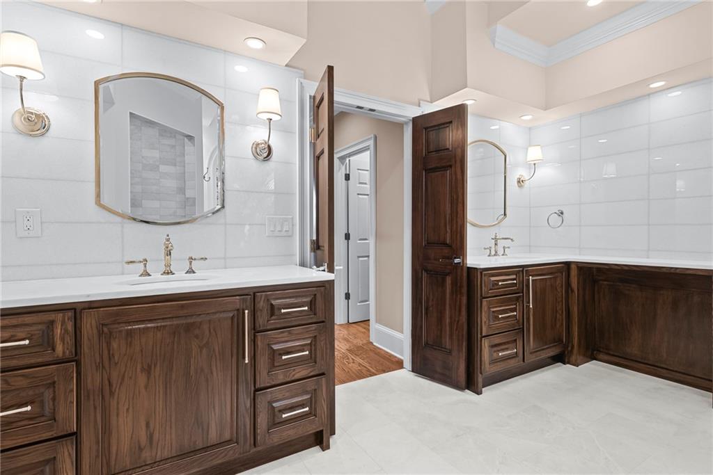 520 Chestnut Rose Lane Sandy Springs, GA 30327 - Photo 45 of 94 a bathroom with a double vanity sink mirror and double