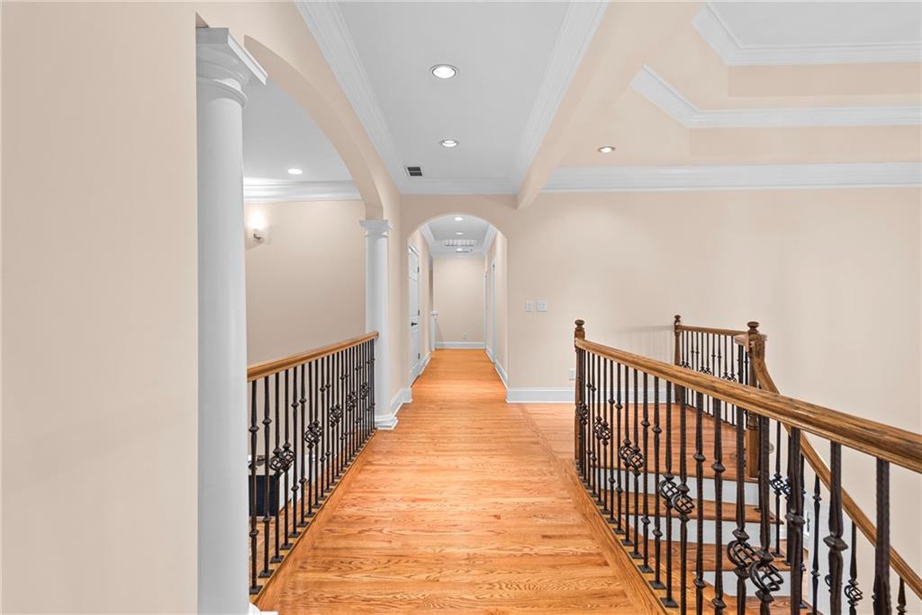 520 Chestnut Rose Lane Sandy Springs, GA 30327 - Photo 48 of 94 a view of a hallway with wooden floor and a bathroom
