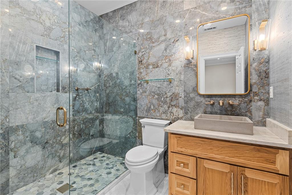 520 Chestnut Rose Lane Sandy Springs, GA 30327 - Photo 50 of 94 a bathroom with a sink toilet and shower