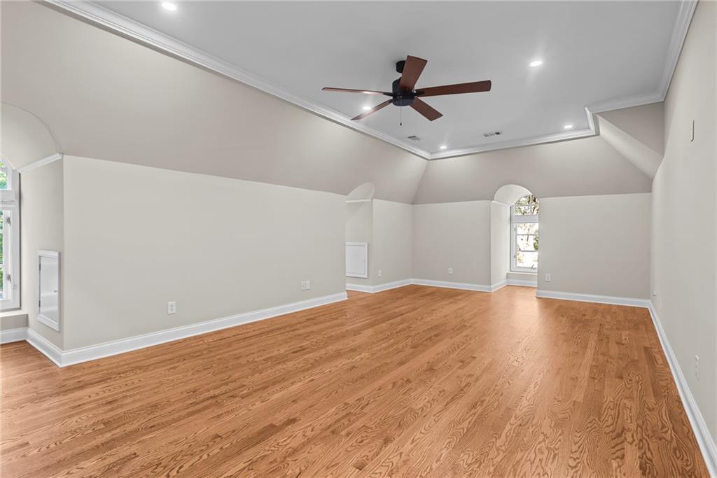 520 Chestnut Rose Lane Sandy Springs, GA 30327 - Photo 51 of 94 a view of empty room with wooden floor and ceiling fan