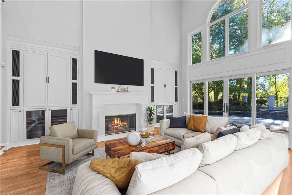 520 Chestnut Rose Lane Sandy Springs, GA 30327 - Photo 6 of 94 a living room with furniture fireplace and flat screen tv