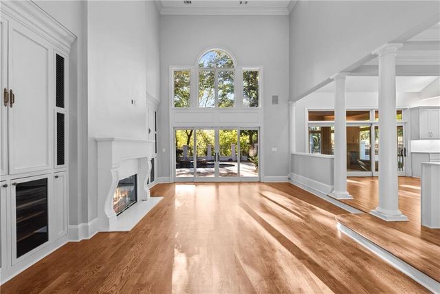 a view of kitchen with kitchen island dining table and chairs