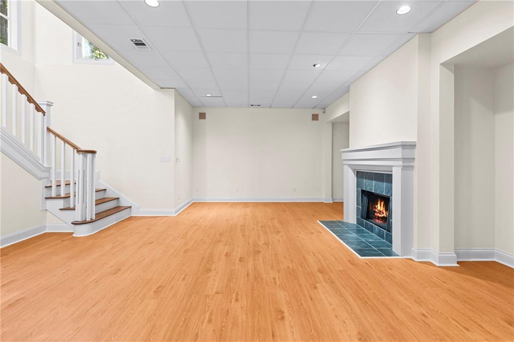 520 Chestnut Rose Lane Sandy Springs, GA 30327 - Photo 74 of 94 a bedroom with a bed and a fireplace