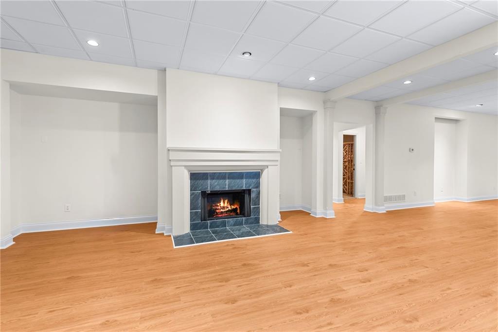 520 Chestnut Rose Lane Sandy Springs, GA 30327 - Photo 78 of 94 a view of an empty room with a fireplace