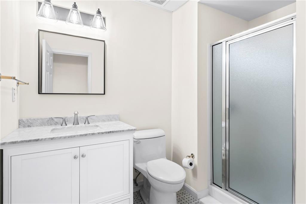 520 Chestnut Rose Lane Sandy Springs, GA 30327 - Photo 83 of 94 a bathroom with a granite countertop sink toilet and mirror