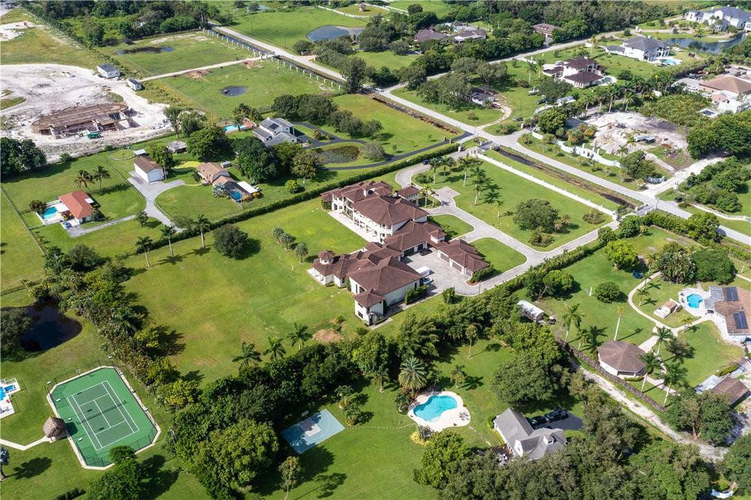 5600 Southwest 136th Avenue Southwest Ranches, FL 33330 - Photo 11 of 32 an aerial view of a residential houses with outdoor space