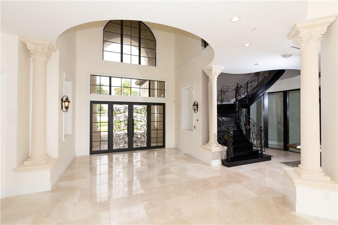 5600 Southwest 136th Avenue Southwest Ranches, FL 33330 - Photo 13 of 32 a view of an entryway with a floor to ceiling window and a living room