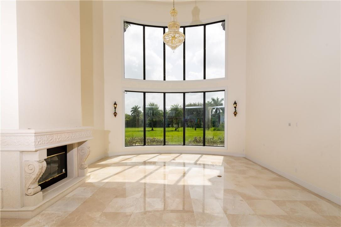5600 Southwest 136th Avenue Southwest Ranches, FL 33330 - Photo 14 of 32 a view of a room with furniture and a fireplace