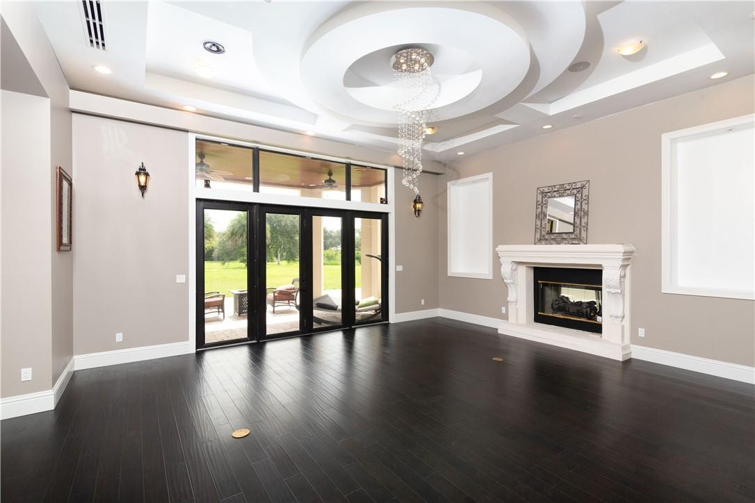 5600 Southwest 136th Avenue Southwest Ranches, FL 33330 - Photo 15 of 32 a view of an empty room with a fireplace and a window