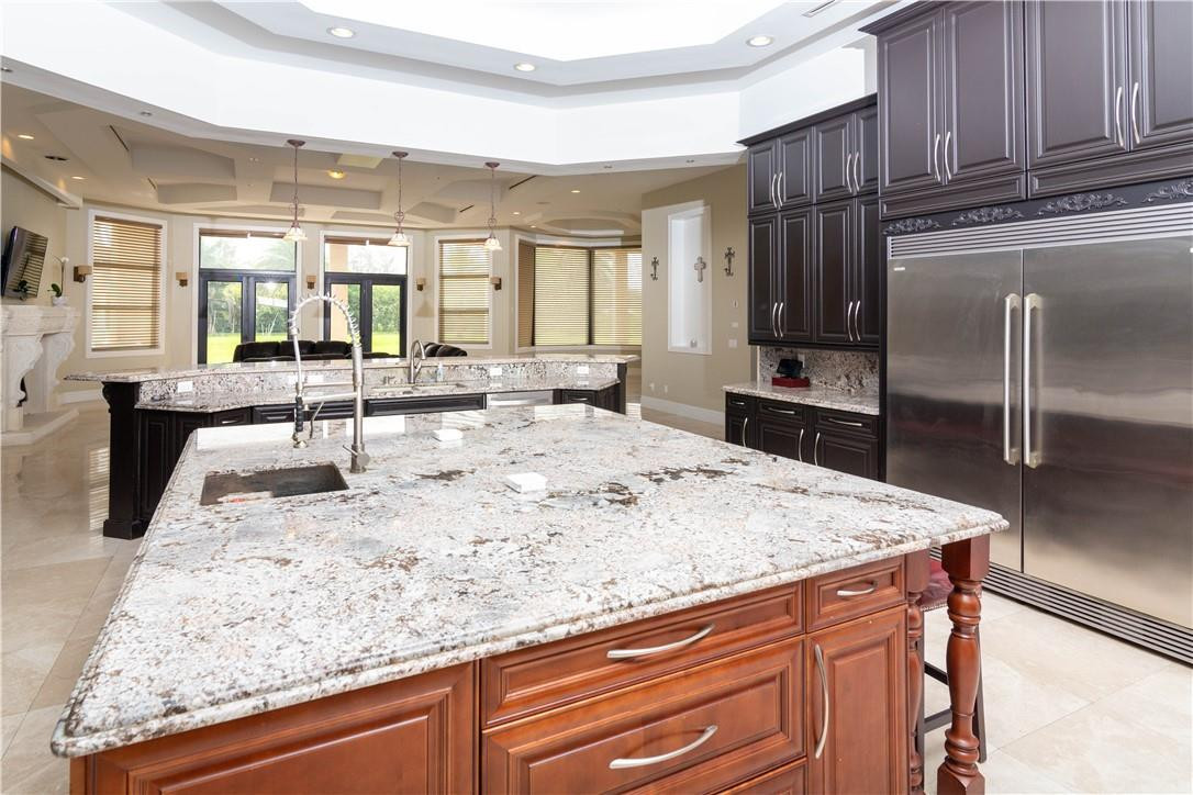 5600 Southwest 136th Avenue Southwest Ranches, FL 33330 - Photo 20 of 32 a view of kitchen island a sink and living room
