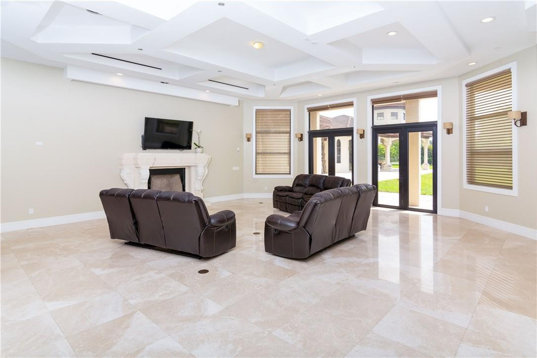 5600 Southwest 136th Avenue Southwest Ranches, FL 33330 - Photo 21 of 32 a living room with furniture and a flat screen tv
