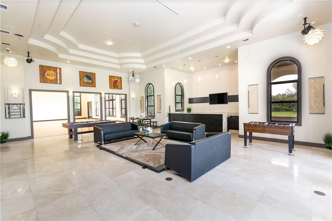 5600 Southwest 136th Avenue Southwest Ranches, FL 33330 - Photo 28 of 32 a living room with furniture and a fireplace