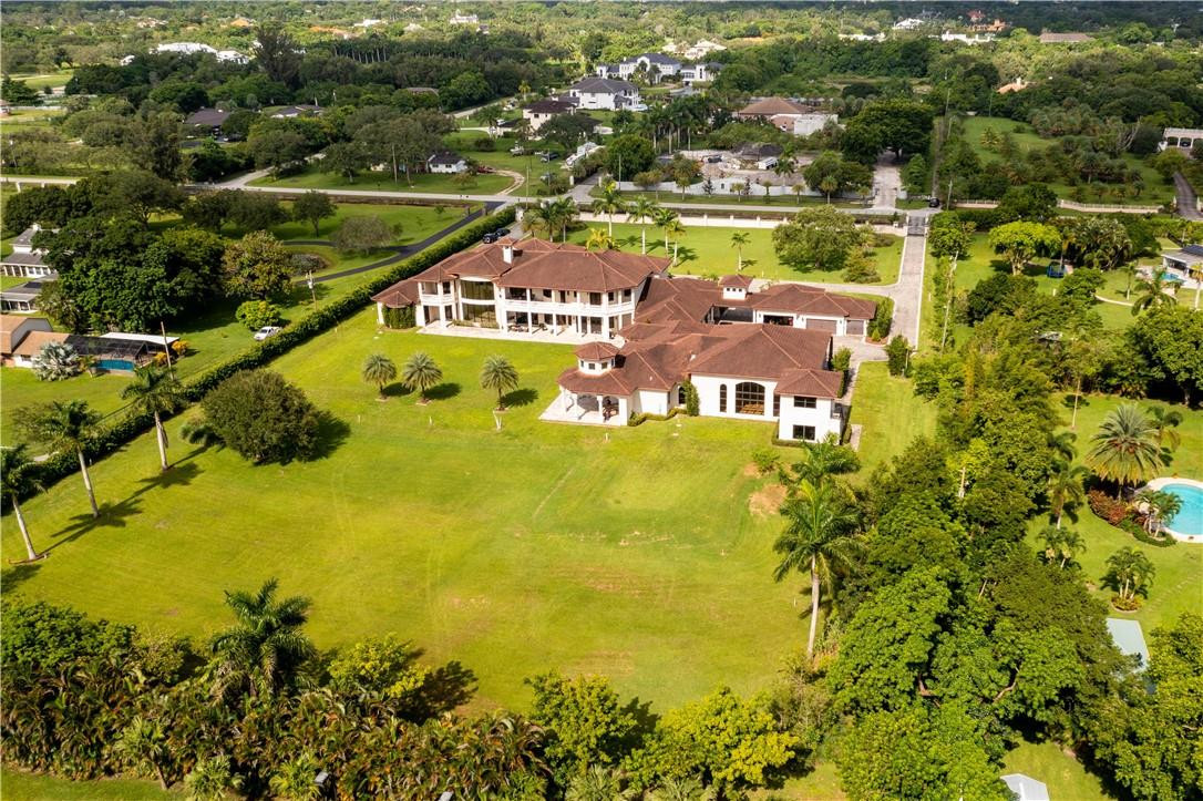 5600 Southwest 136th Avenue Southwest Ranches, FL 33330 - Photo 9 of 32 an aerial view of residential houses with outdoor space and swimming pool