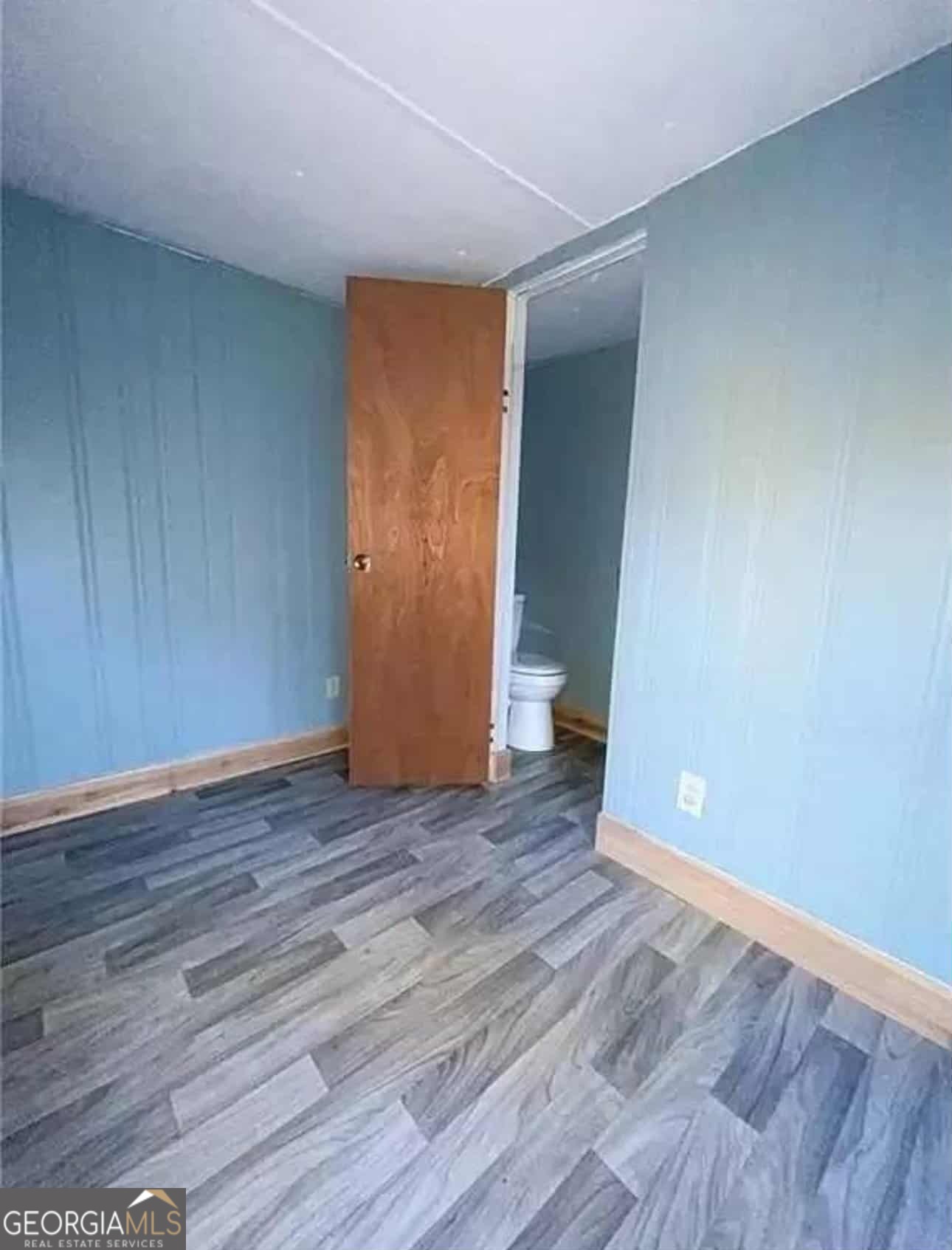 262 Blacks Bluff Road Southwest Rome, GA 30161 - Photo 13 of 16 a view of an empty room with wooden floor