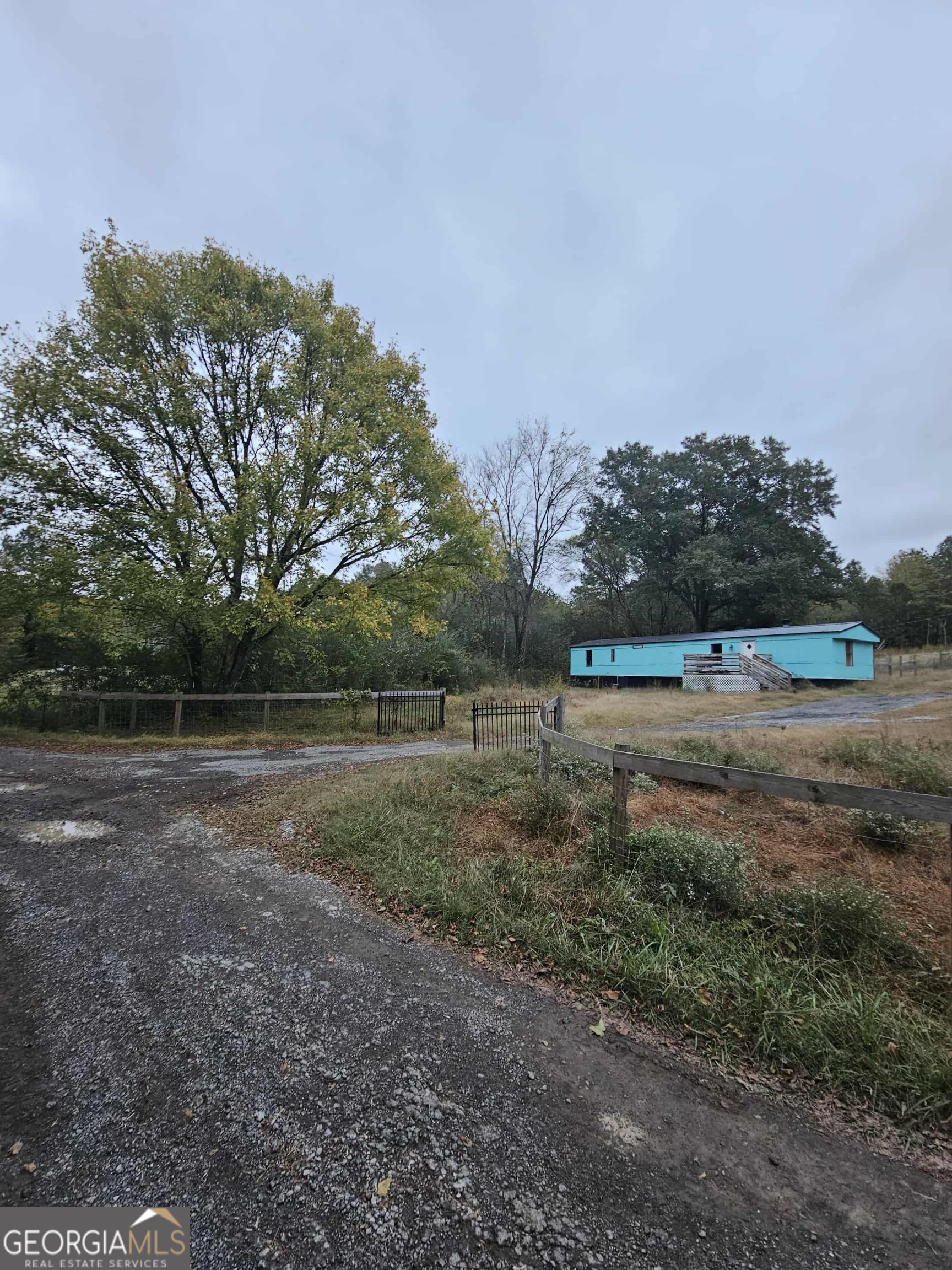262 Blacks Bluff Road Southwest Rome, GA 30161 - Photo 6 of 16 a view of outdoor space with green field and trees