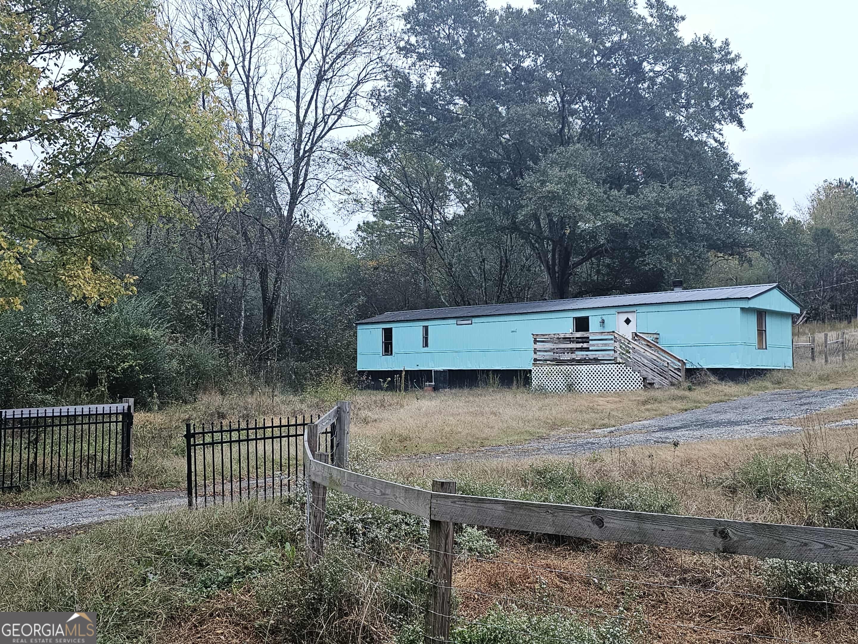262 Blacks Bluff Road Southwest Rome, GA 30161 - Photo 7 of 16 a view of a yard with wooden fence