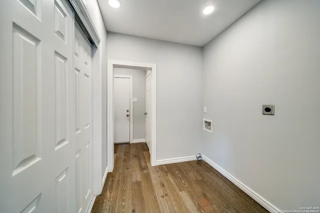 a bathroom with a granite countertop shower sink and mirror