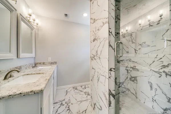 a bathroom with a bathtub and shower