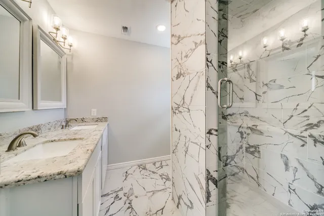 a bathroom with a bathtub and shower