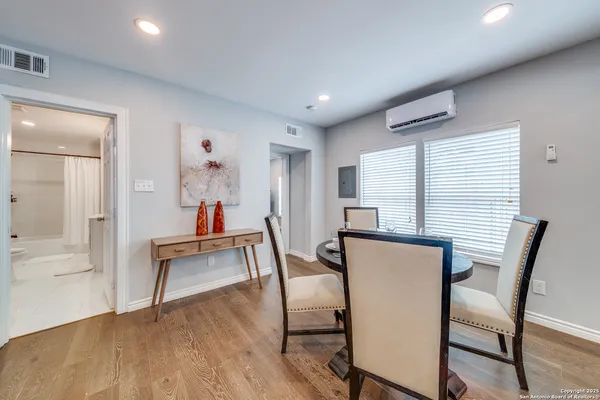 a dining room with furniture and window