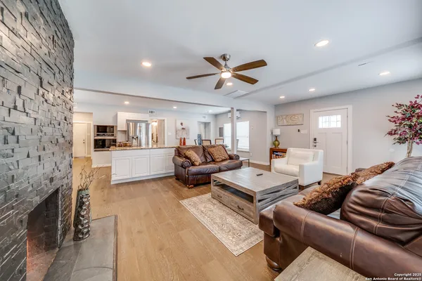 a living room with furniture and a fireplace