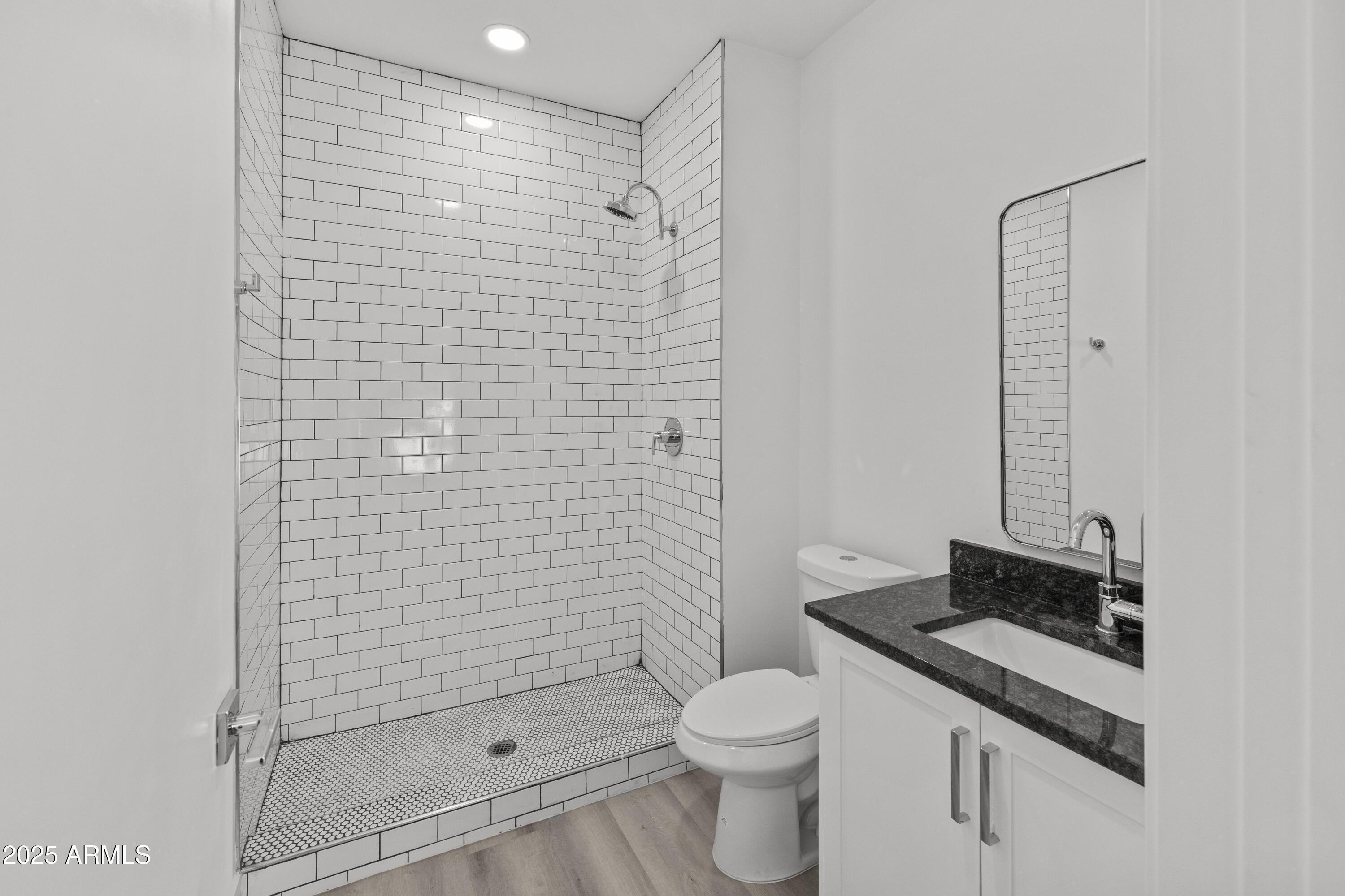 3130 North 37th Street, Unit 13 Phoenix, AZ 85018 - Photo 11 of 15 a bathroom with a sink a toilet and shower