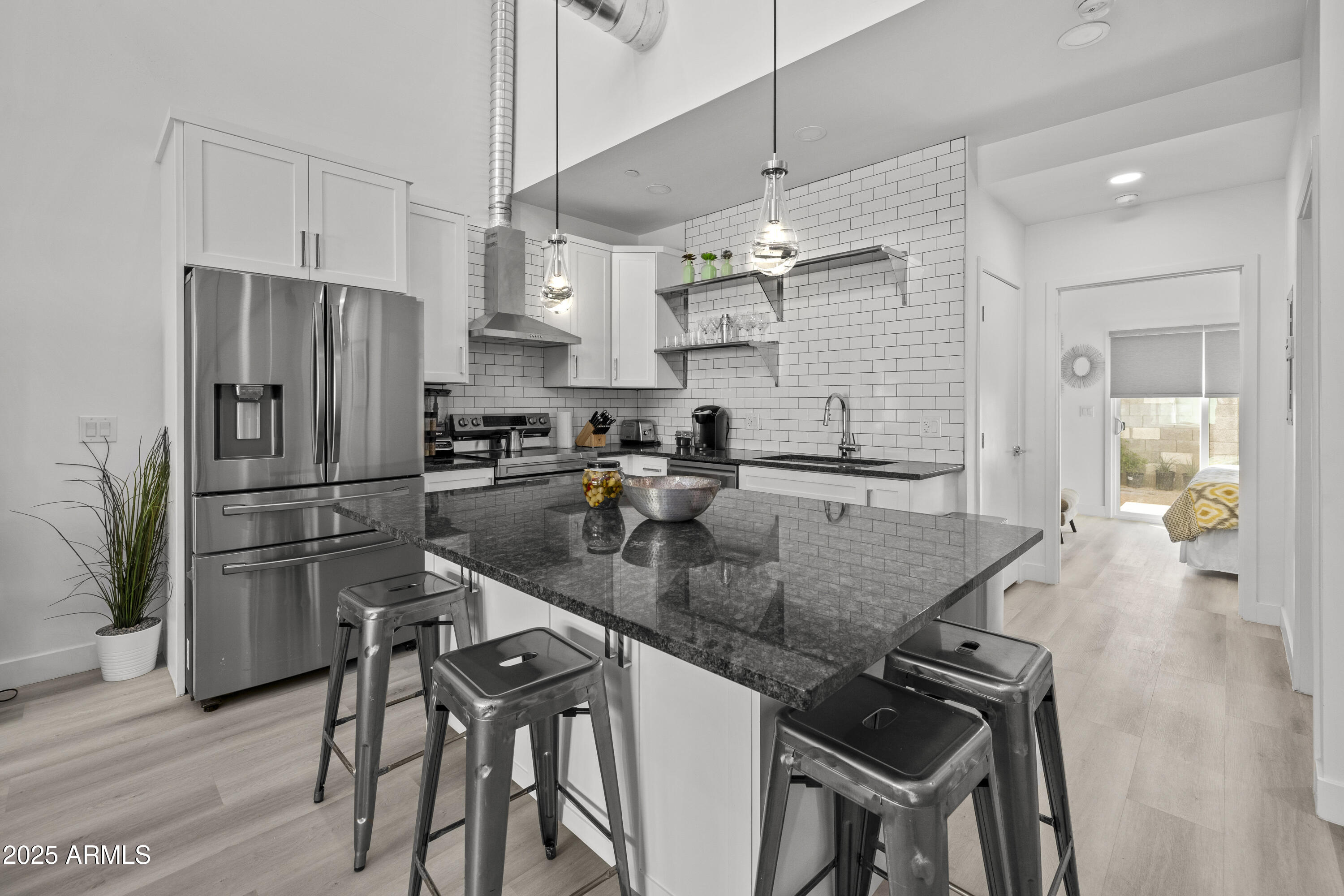 3130 North 37th Street, Unit 13 Phoenix, AZ 85018 - Photo 4 of 15 a kitchen with stainless steel appliances granite countertop a sink refrigerator and cabinets