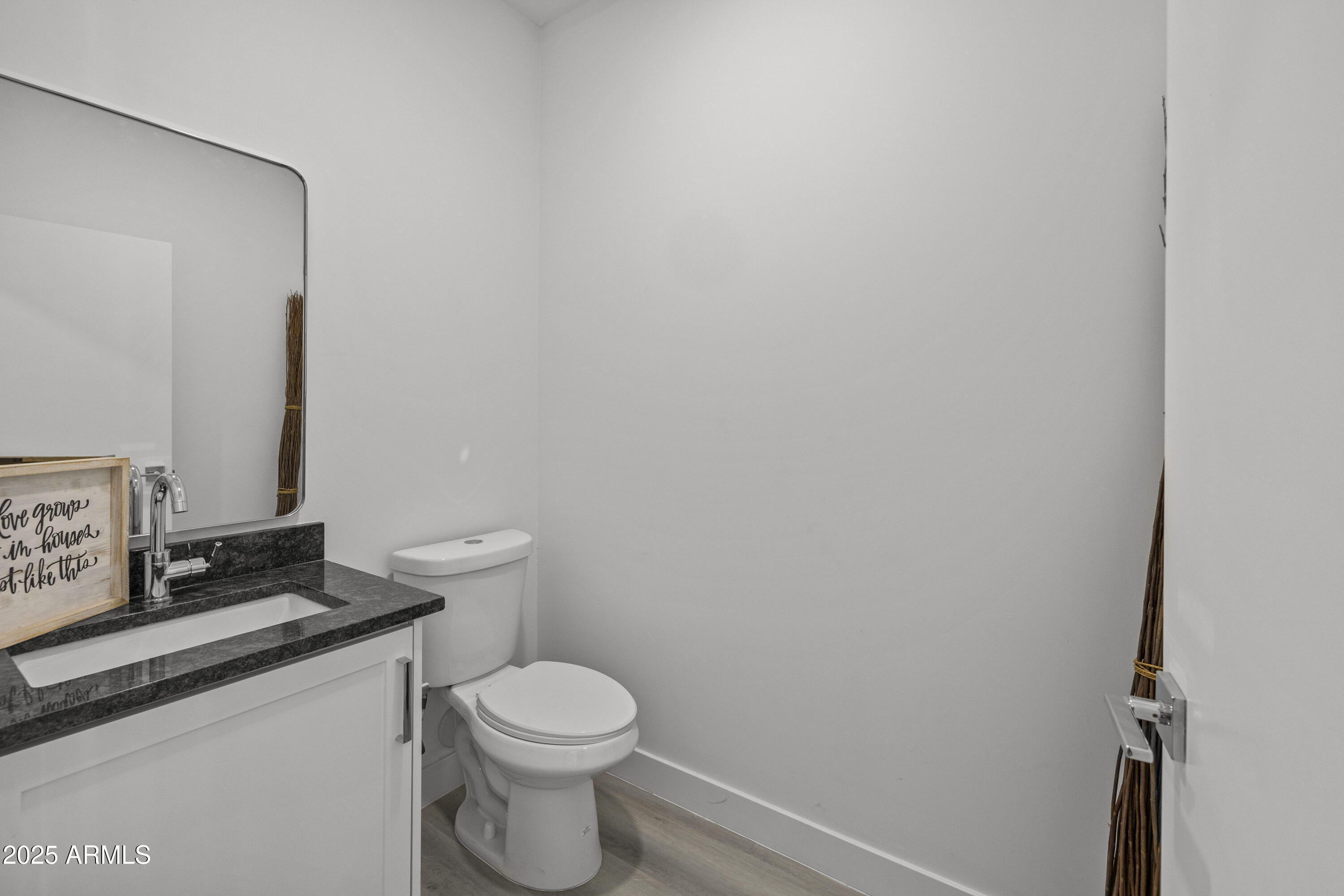 3130 North 37th Street, Unit 13 Phoenix, AZ 85018 - Photo 6 of 15 a white toilet sitting next to a bathroom sink