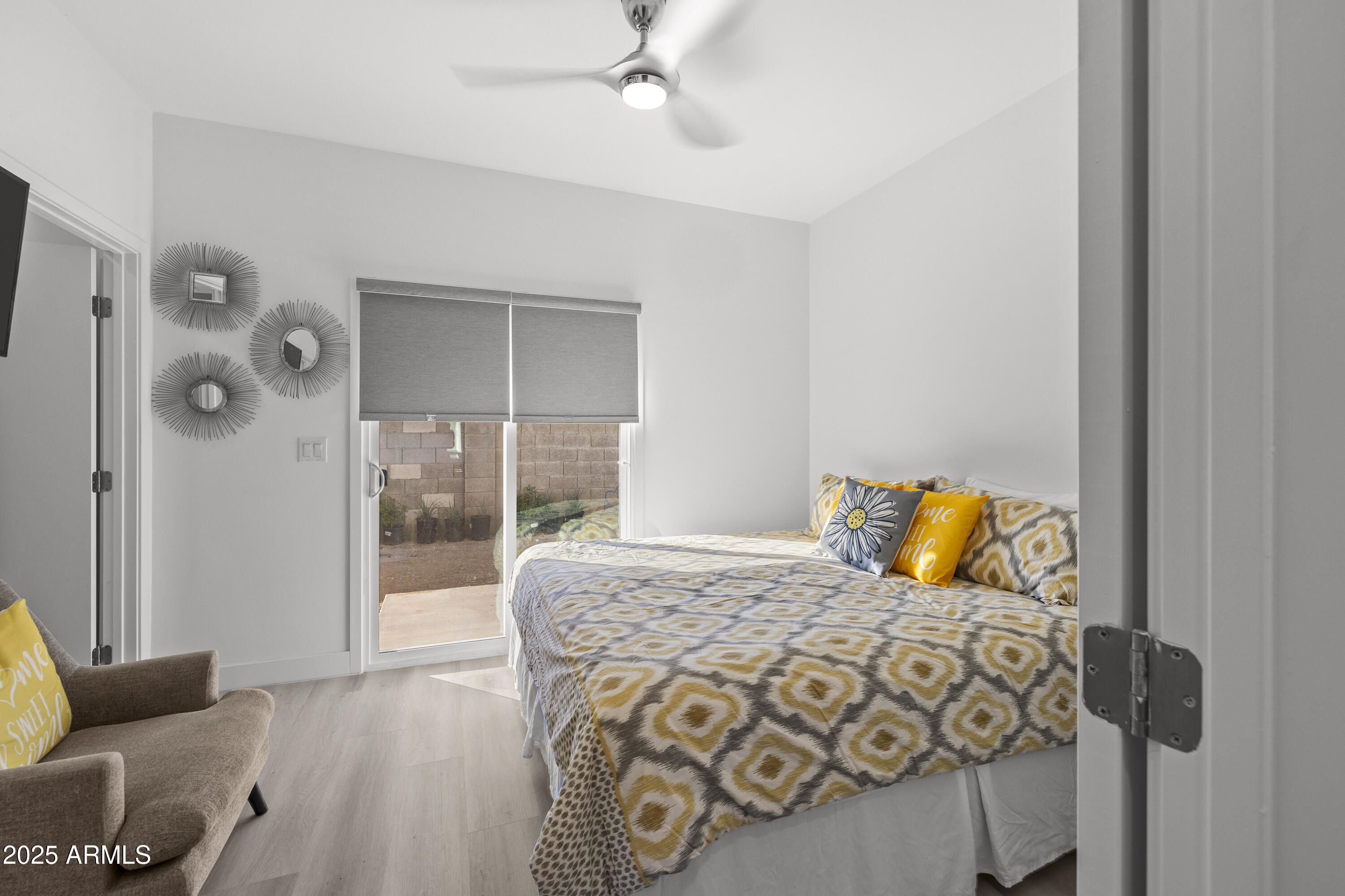 3130 North 37th Street, Unit 13 Phoenix, AZ 85018 - Photo 7 of 15 a bedroom with a bed and glass window