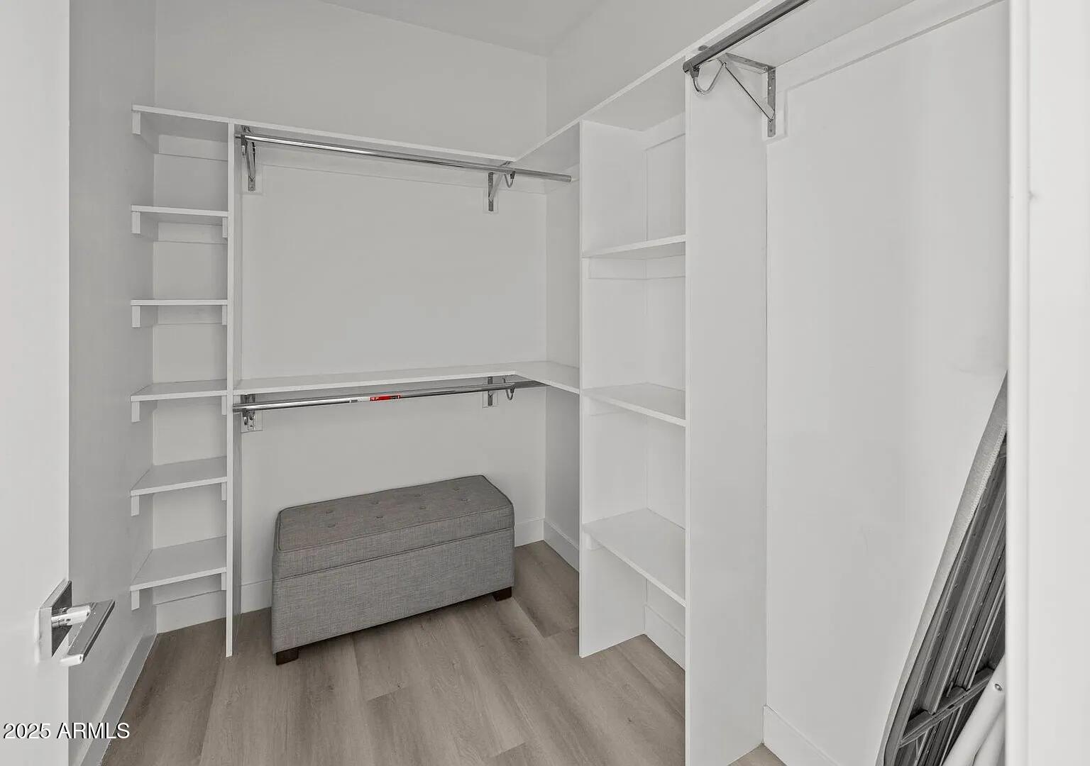 3130 North 37th Street, Unit 13 Phoenix, AZ 85018 - Photo 8 of 15 a view of walk in closet with empty racks