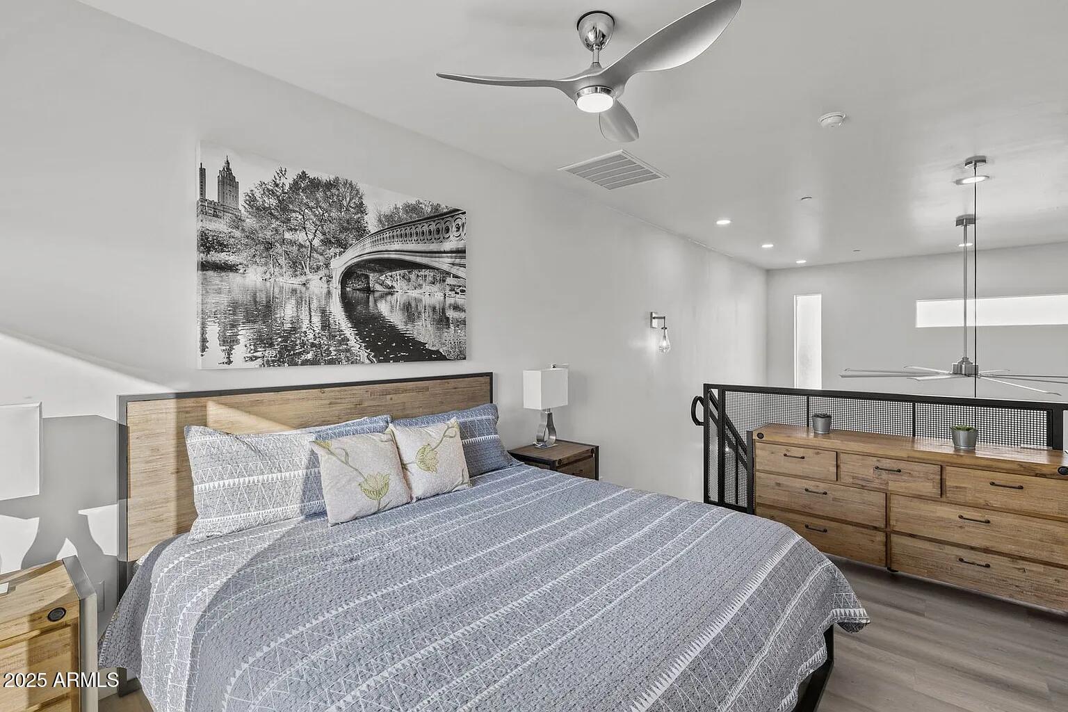 3130 North 37th Street, Unit 13 Phoenix, AZ 85018 - Photo 10 of 15 a bedroom with a bed and ceiling fan