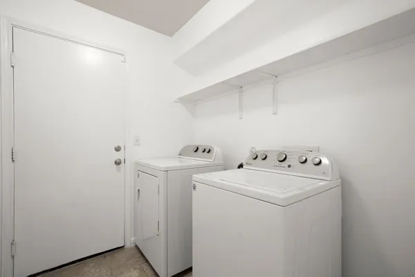 a utility room with dryer and washer