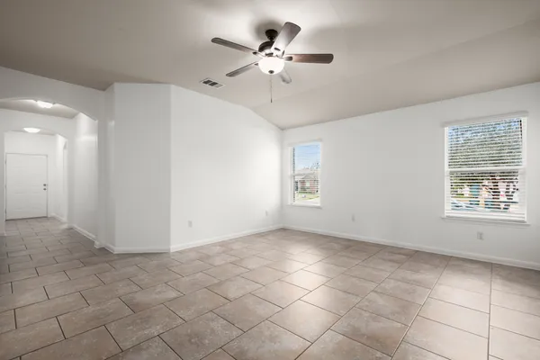 a view of an empty room with a window