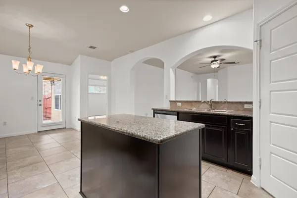 a kitchen with a sink and stove