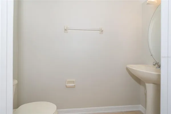 a bathroom with a sink and toilet