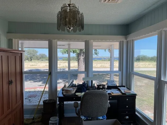 a room with furniture and large windows