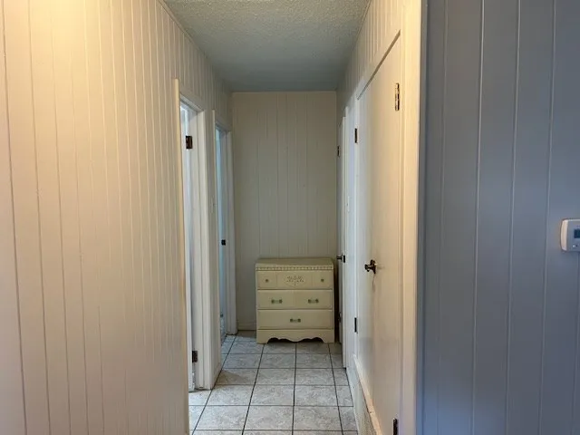 a bedroom with bed and a window