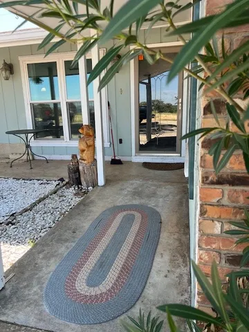 a view of a porch with furniture