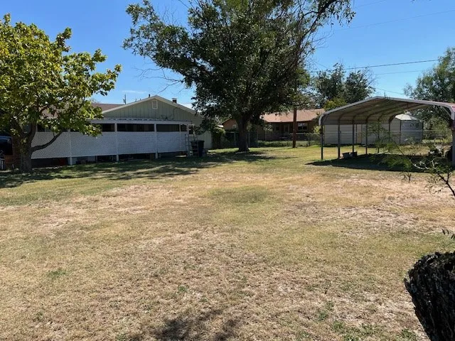 a view of a lake with a house in the background