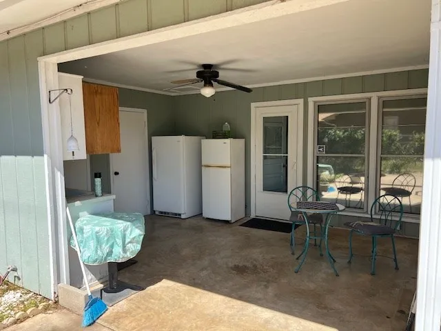 a kitchen that has a refrigerator and a sink