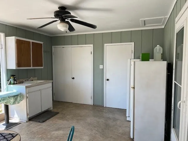 a utility room with cabinets dryer and washer